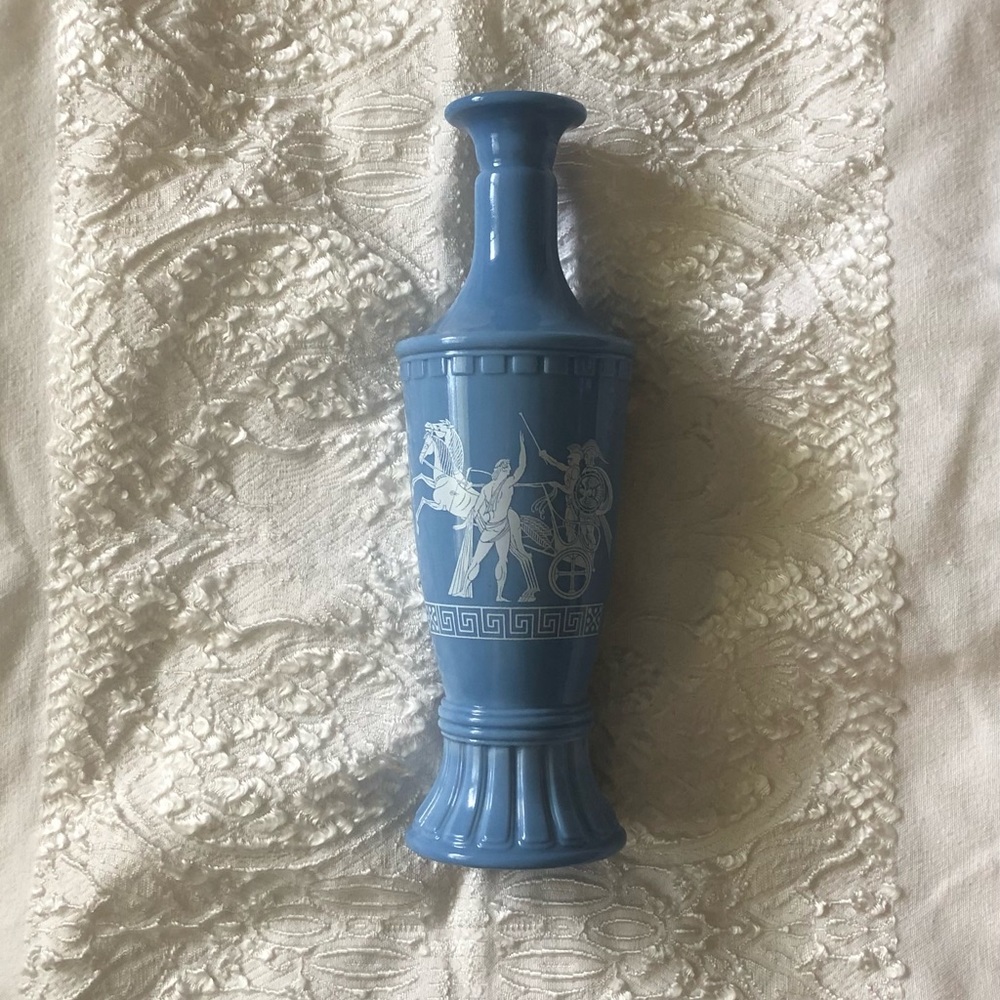 Post-prohibition blue glass liquor holder with Greek & Roman motif
